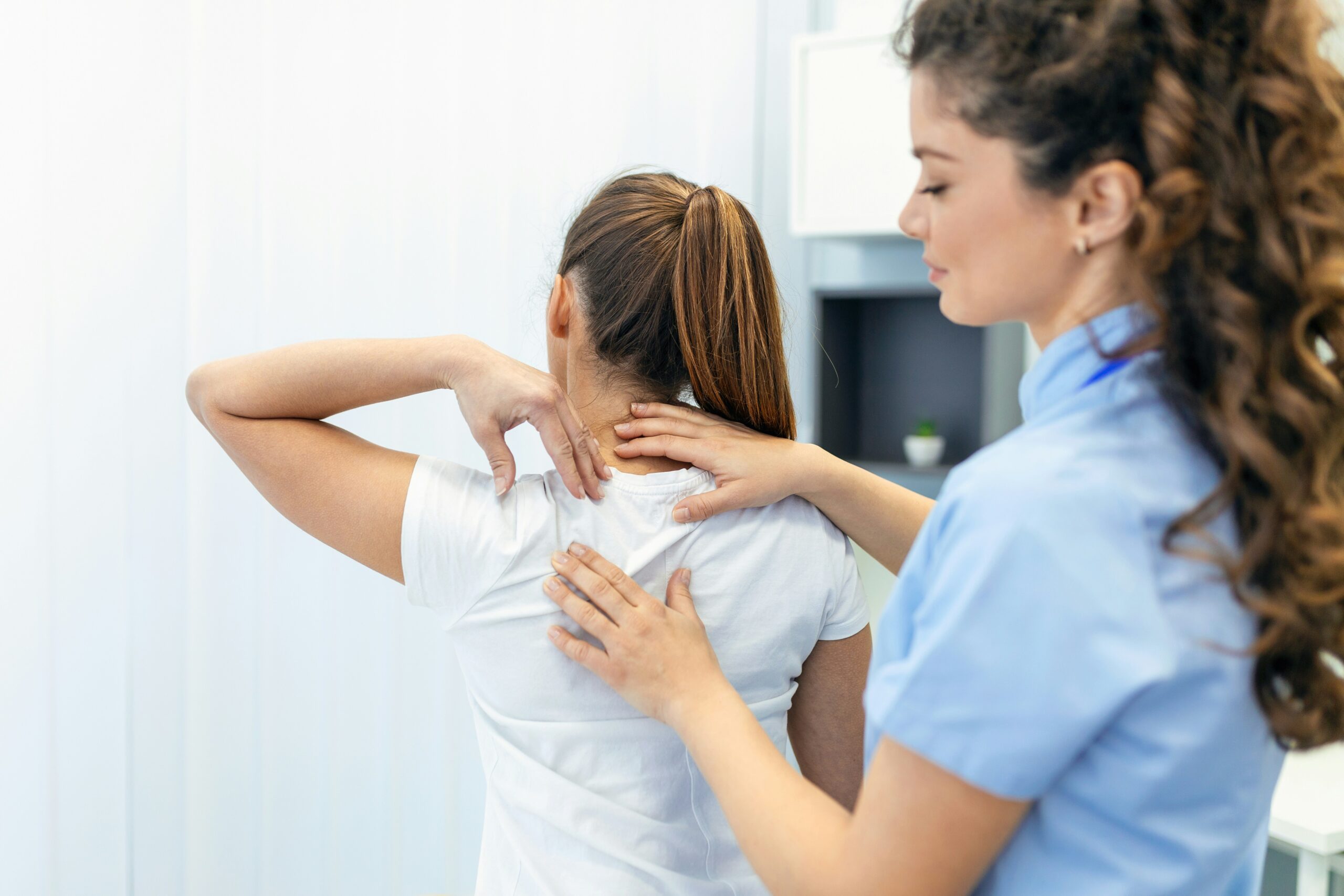 Physical therapist performing back pain treatment in Chicago clinic